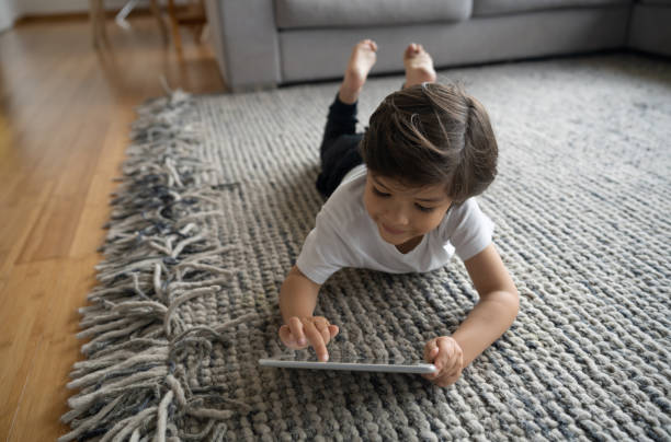 Girl lying on rug | Bob's Carpet and Flooring