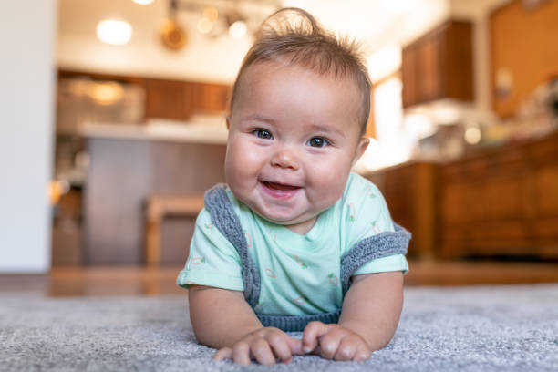 Baby lying on rug | Bob's Carpet and Flooring