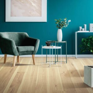 Teal accent wall in a seating area with new laminate floors