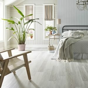 Light Grey Luxury Vinyl flooring in a bright bedroom