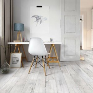 Home office with neutral and light tile flooring by Magnolia Bend