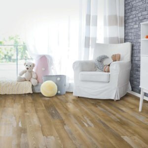 Laminate flooring in a child's nursery with a white armchair