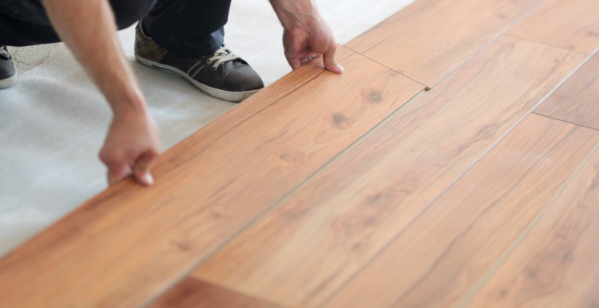 Flooring professional installing laminate floors