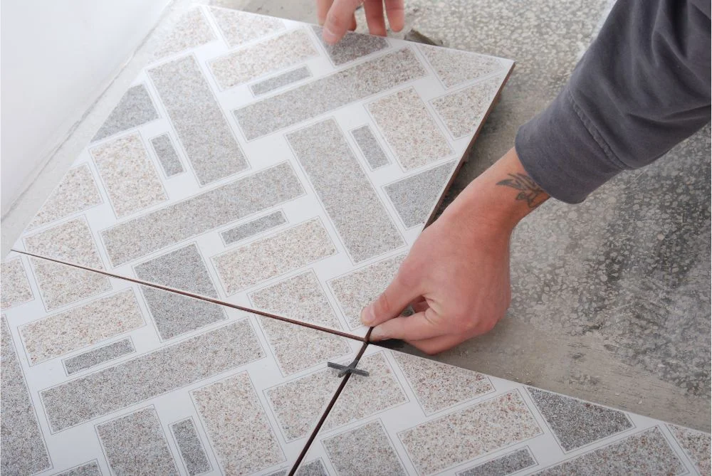 Flooring professional installing tile